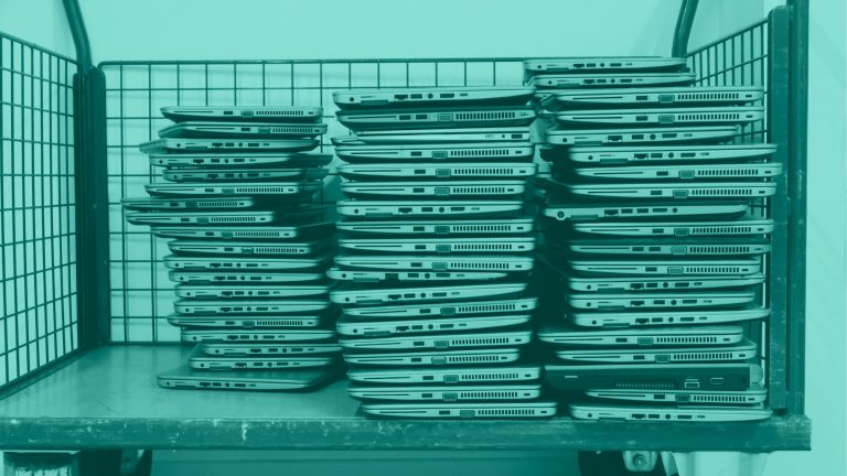 cart full of laptops and tablets for school device inventory